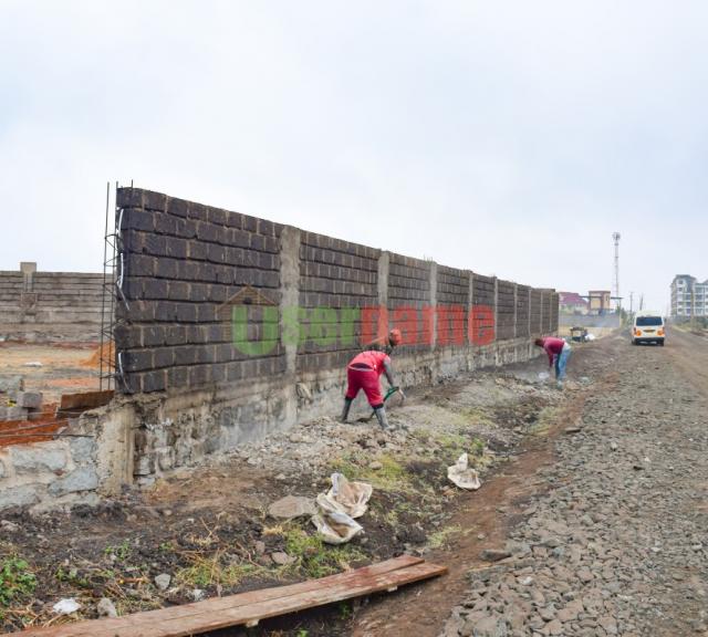 Ongoing Construction of Stone Wall Fence at Royale Court - Juja