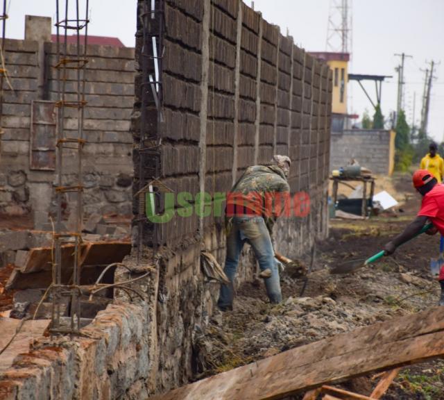 Ongoing Construction of Stone Wall Fence at Royale Court - Juja